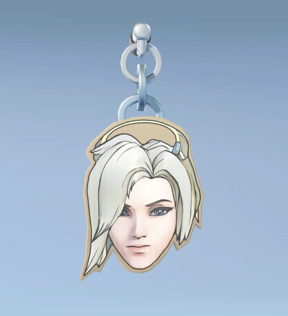 Pingente de arma com a máscara da Mercy